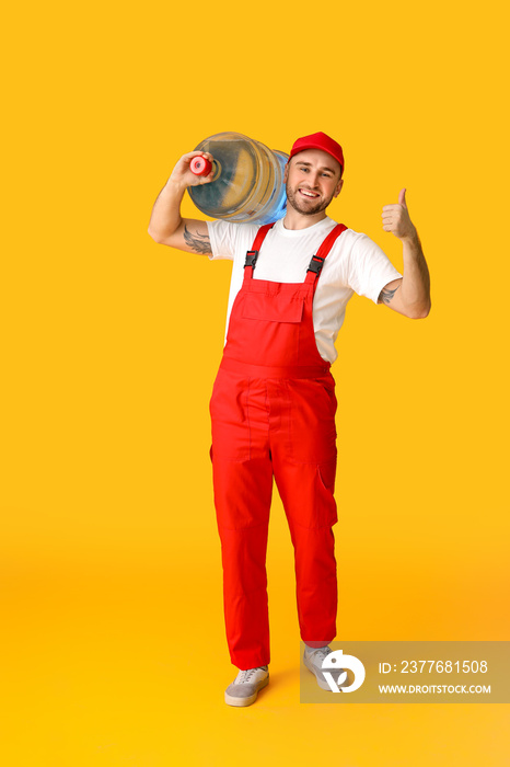 Delivery man with bottle of water on color background