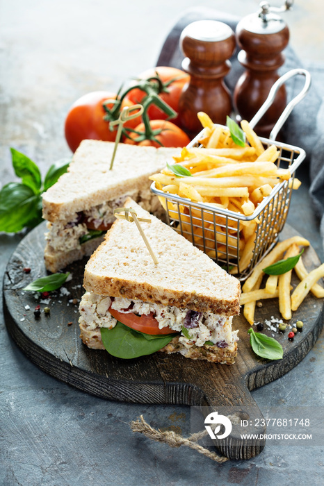 Chicken salad sandwich with spinach and tomato