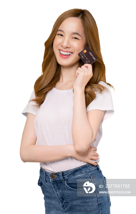 Cheerful beautiful Asian woman in white t-shirt and holding mockup credit card on screen background, PNG transparent.