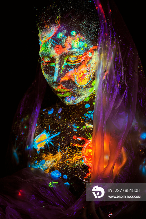 UV painting of a universe on a female body portrait