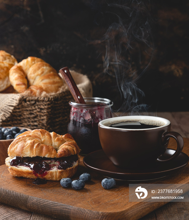 Croisant With Blueberry Jam and Cup of Coffee