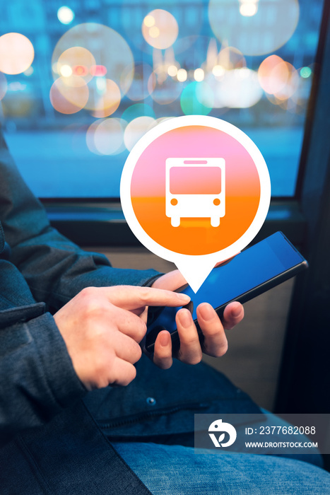 Woman using mobile phone app to purchase bus electronic ticket