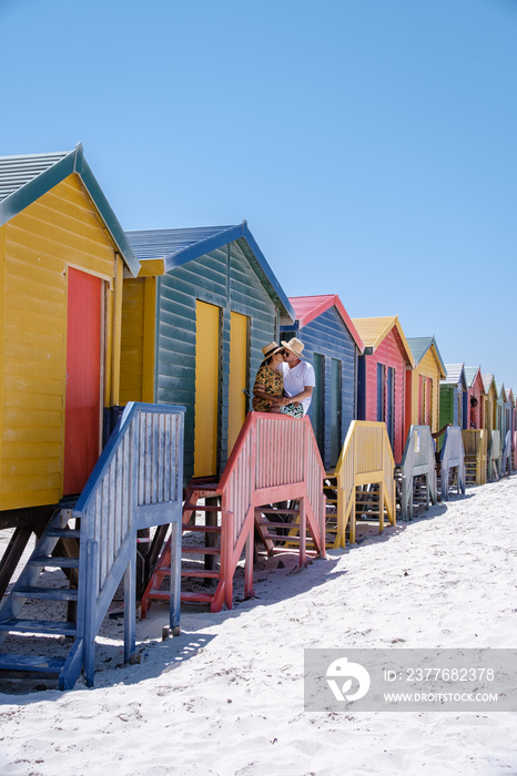 colorful beach house at Muizenberg beach Cape Town, beach huts, Muizenberg, Cape Town, False Bay, South Africa. couple man and woman at the beach