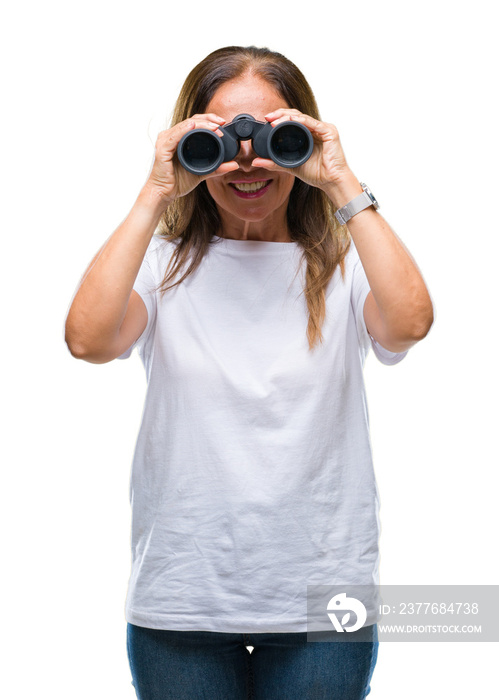 Middle age hispanic woman looking through binoculars over isolated background with a happy face standing and smiling with a confident smile showing teeth