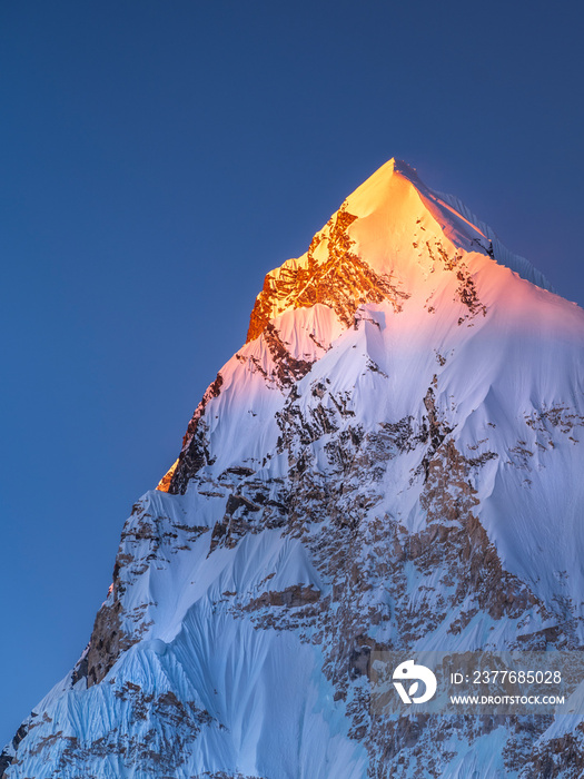 last golden light on the snow peak in Himalaya in Nepal