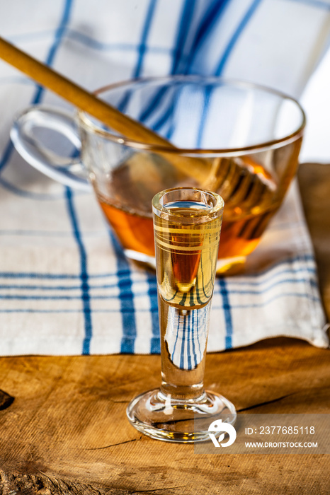 homemade mead (honey wine) on an old table close up