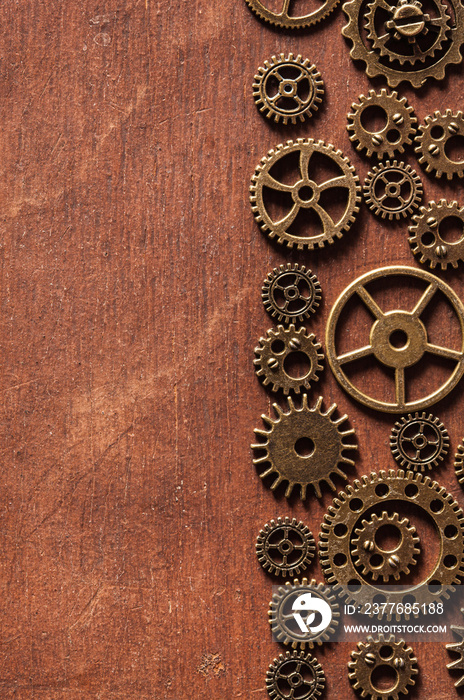 steampunk mechanical cogs gears wheels on wooden background