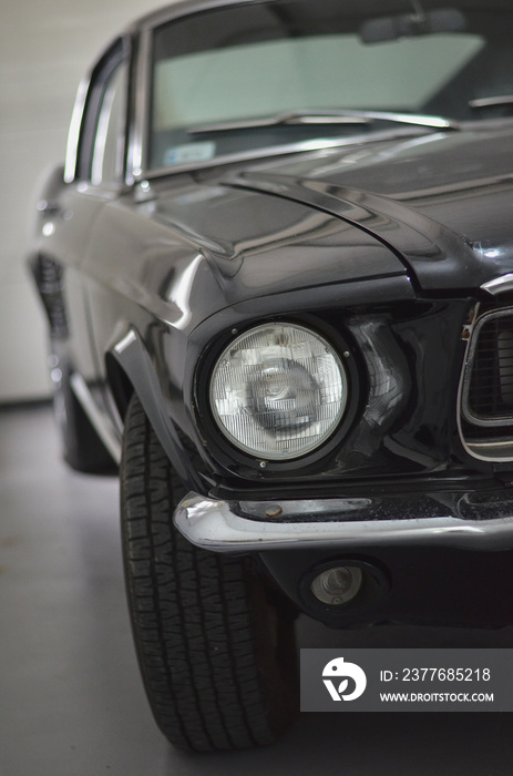 Front part of a retro vintage car in the garage