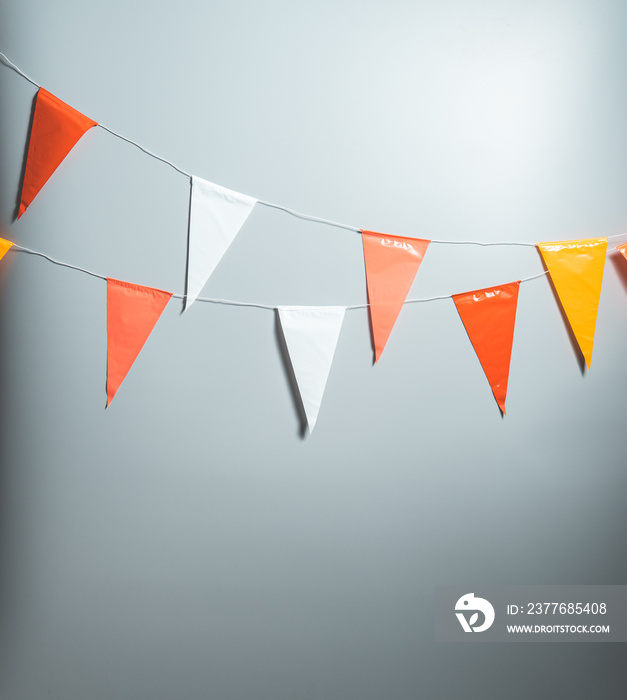 Party flags for decoration and covering on grey background