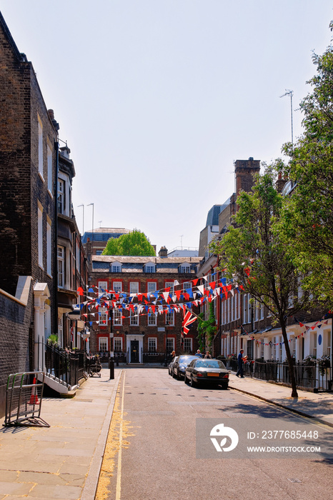 Street with flags in London city