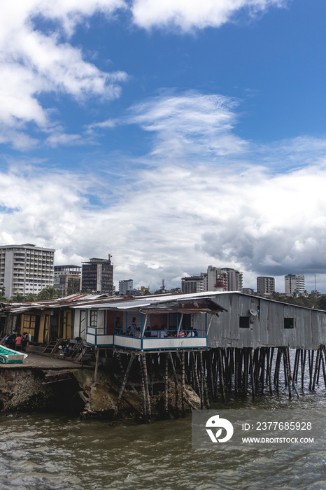 Houses and buildings of the city of Buenaventura Valle del Cauca Colombia. Pier, beach and sea.