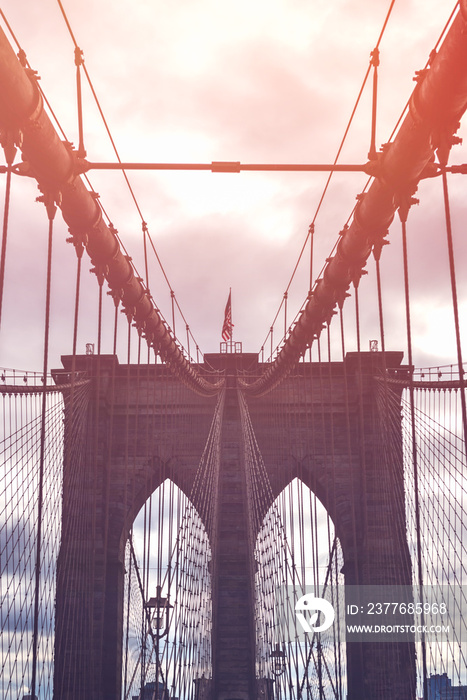 Details of the Brookylin Bridge in New York City, USA. Toned image with sun light leak