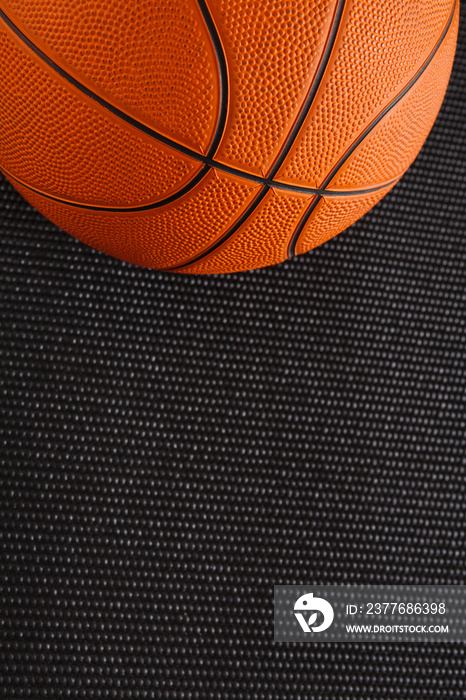 Basketball ball on black background copy space