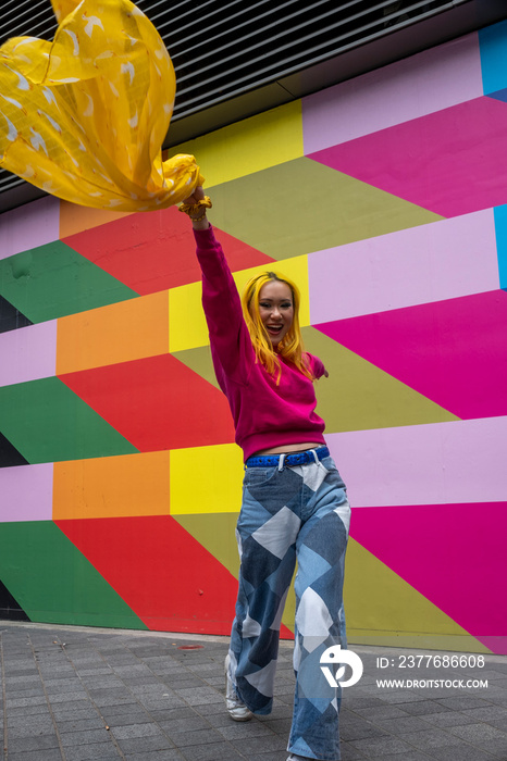 Portrait of smiling young woman with yellow hair