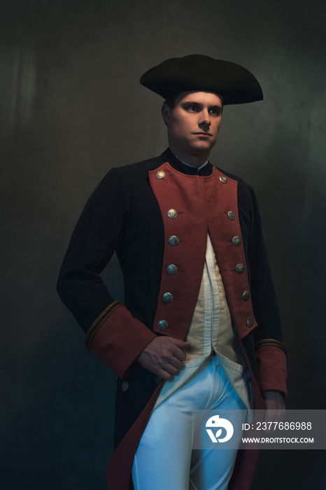 Serious historical regency man in hat and jacket.