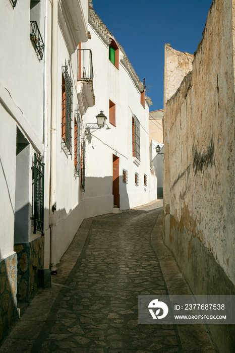 View of the desolated street with typical Spanish houses in Alcalá del Júcar, Albacete, Spain