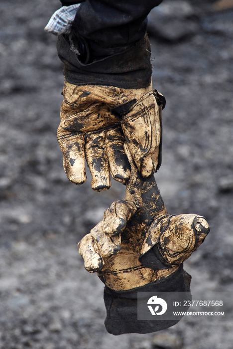 Used and damaged work gloves.  Interesting texture of old safety gloves.