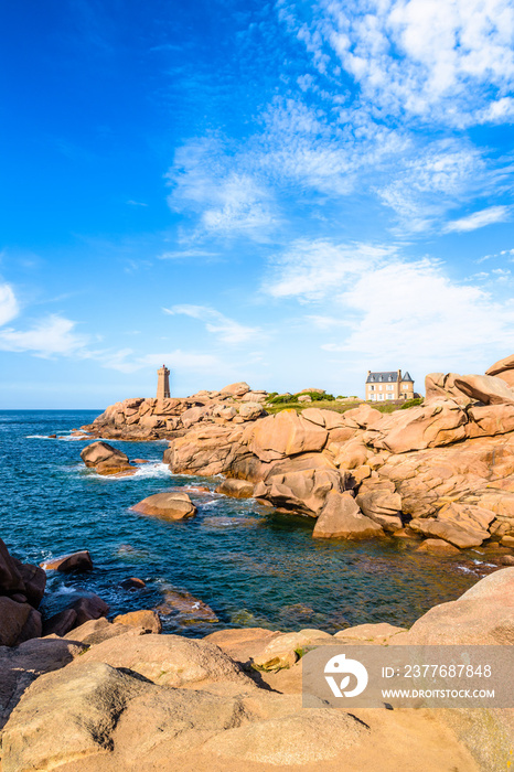 Landscape on the Pink Granite Coast in northern Brittany on the municipality of Perros-Guirec, France, with the Ploumanac’h lighthouse, named Mean Ruz and made of the same pink granite.