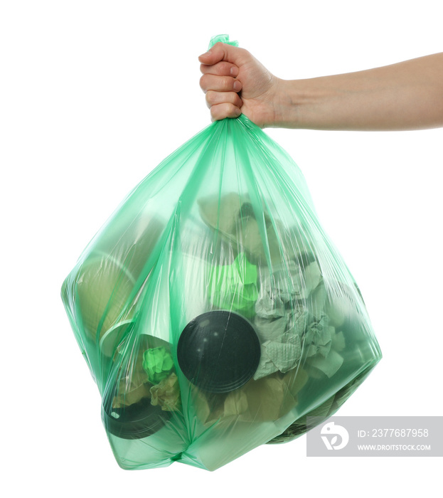 Hand holding disposable bag with different trash, isolated on white background