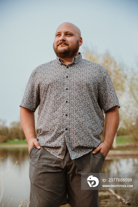 closeup of plus size bald man looking away