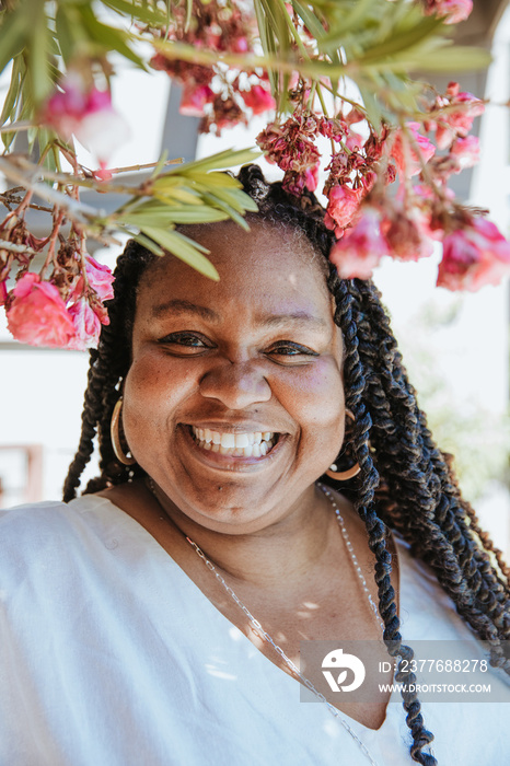 close up portrait of a plus size afro latinx haitian american woman smiling