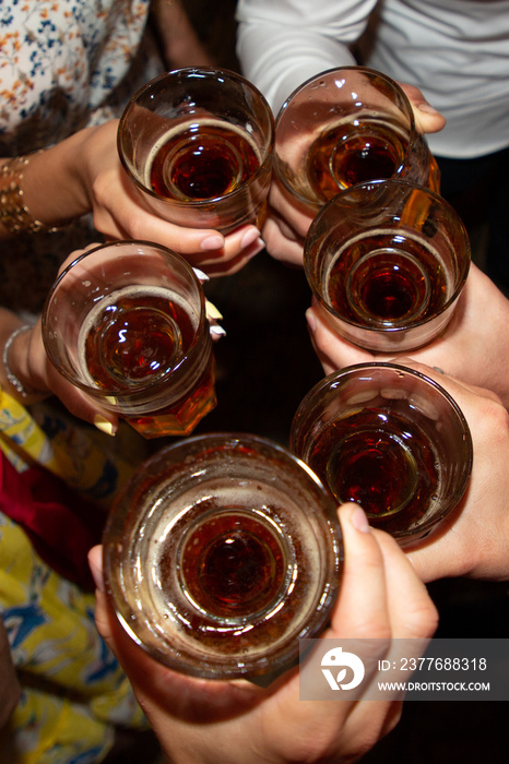 Group of friends toasting with wine glasses at party events