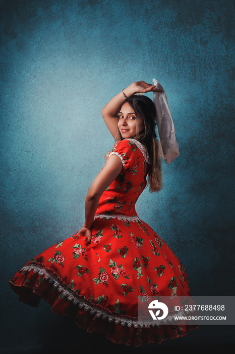 young chilean woman with national dress or folk costume and head headscarf to celebrate national holidays portrait