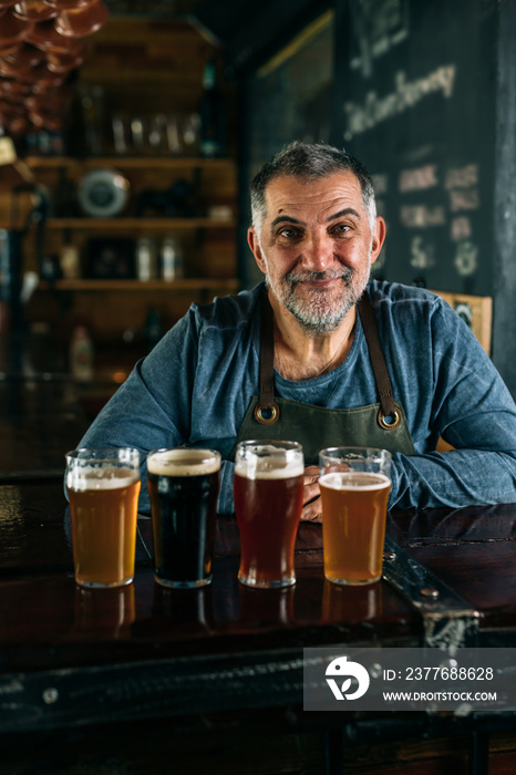 barman serving beer in pub