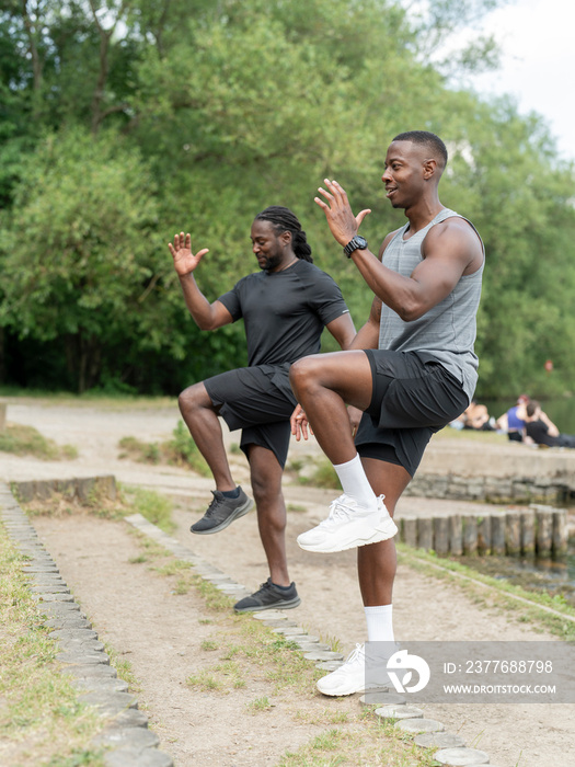 Two men exercising in park