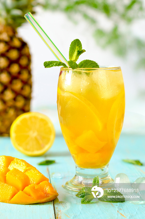 Yellow iced tea with pineapple, lemon