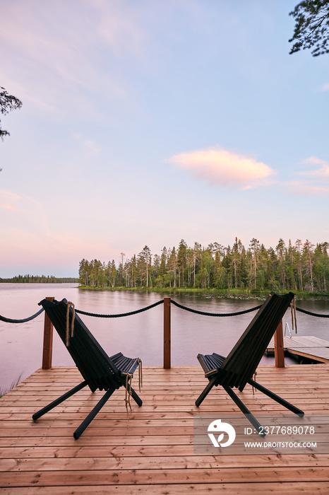 two patio chairs, outdoor armchair lake view cabin with a beautiful sunset view forest in the background amazing inspiration yard design lapland finland