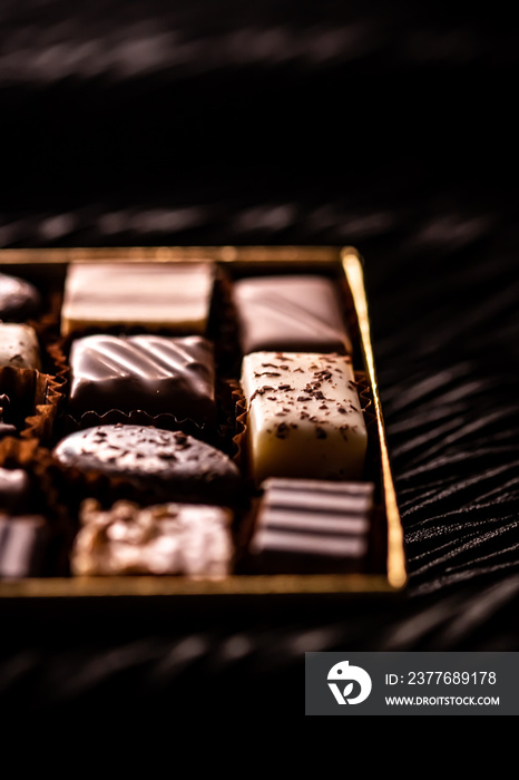 Swiss chocolates in gift box, various luxury pralines made of dark and milk organic chocolate in chocolaterie in Switzerland, sweet dessert food as holiday present and premium confectionery brand.