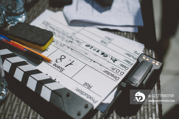 Assistant director with clapperboard on set. Close-up of firecrackers for filming a movie