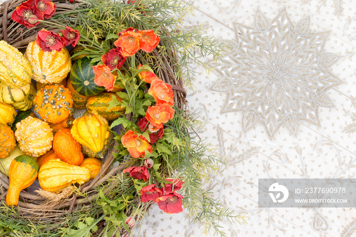 Colorful fall centerpiece with gourds and flowers