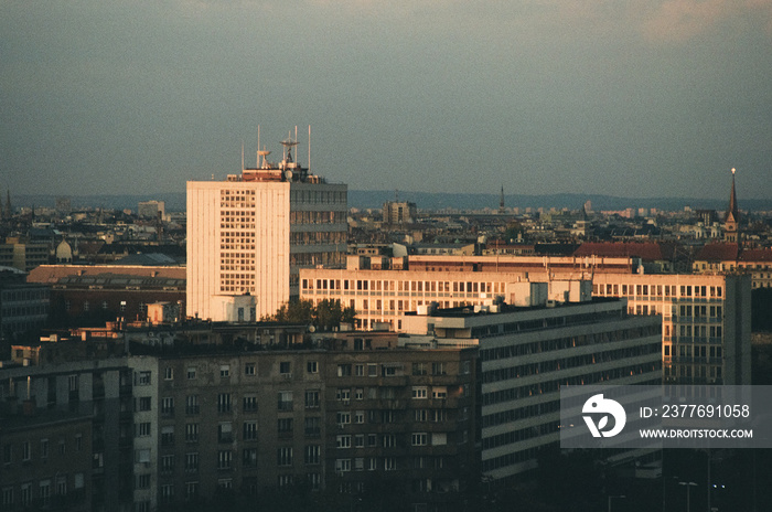 Analog photo of a city in sunset