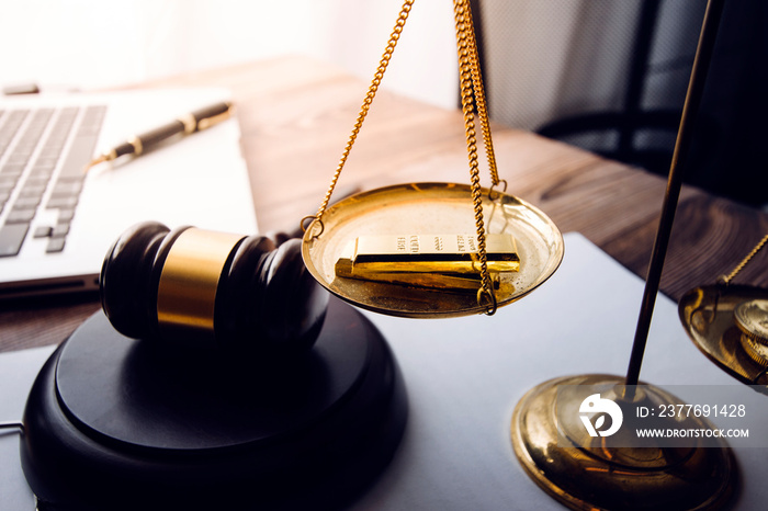 Business and lawyers discussing contract papers with brass scale on desk in office. Law, legal services, advice, justice and law concept picture with film grain effect