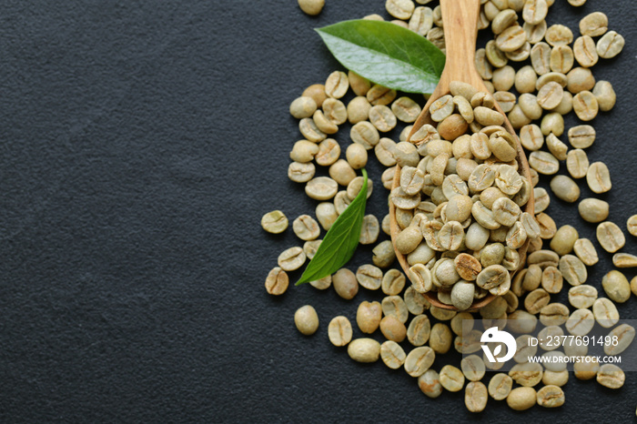 natural organic green coffee beans on a black background