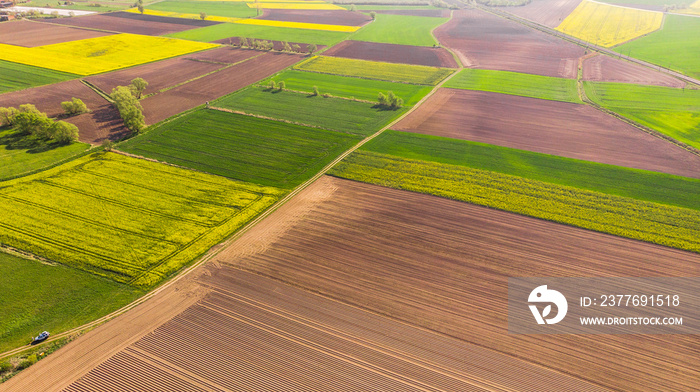 Colorful agriculture farmland at spring, aerial drone view