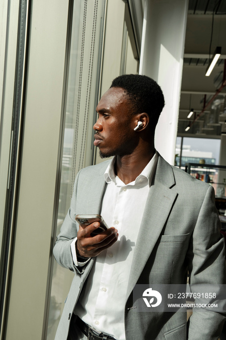 Young businessman using smart phone