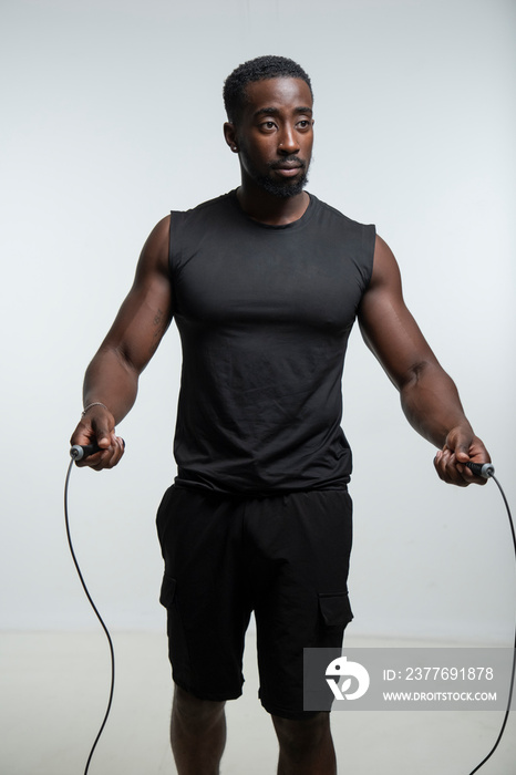 Man using jump rope during training