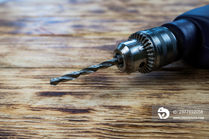 drill on a wooden background