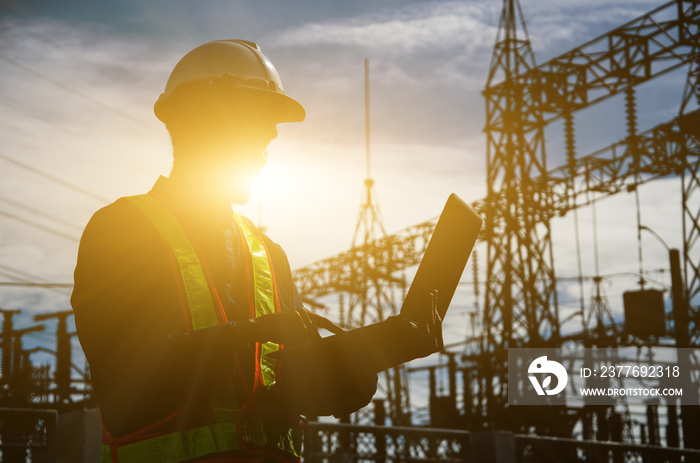 Silhouette of working engineer in the construction site.