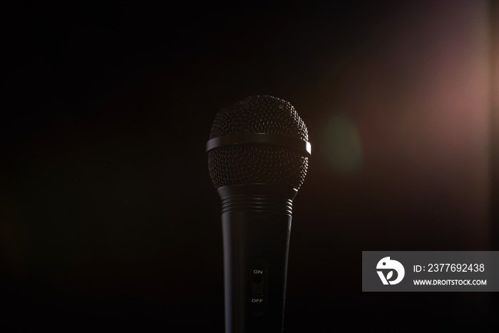 black studio microphone on a dark background