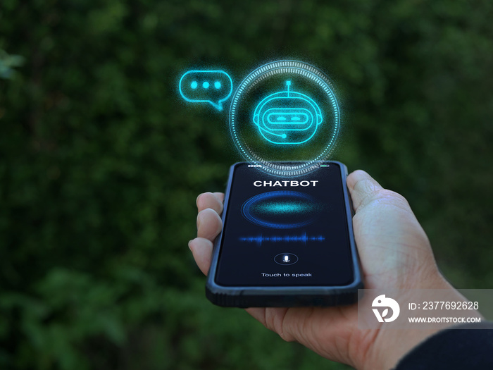 Digital chatbot, conversational agents, robot application, conversation assistant mimic human speech. Hand holding smartphone with chatterbot on virtual screen. AI Artificial Intelligence technology