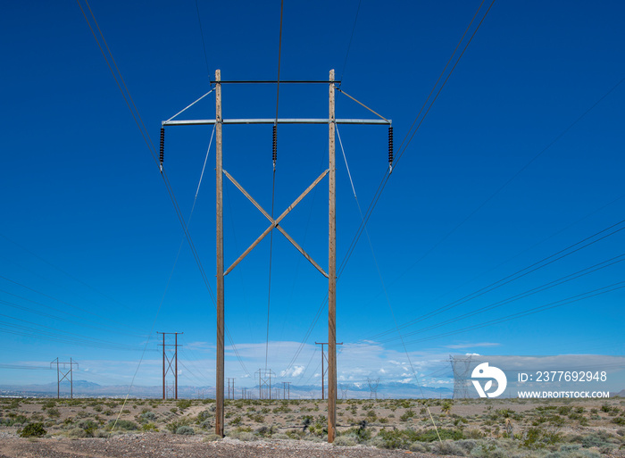 USA, Nevada, Clark County, Las Vegas Valley. A high voltage power transmission line in a utility corridor carrying renewable energy from solar panels.