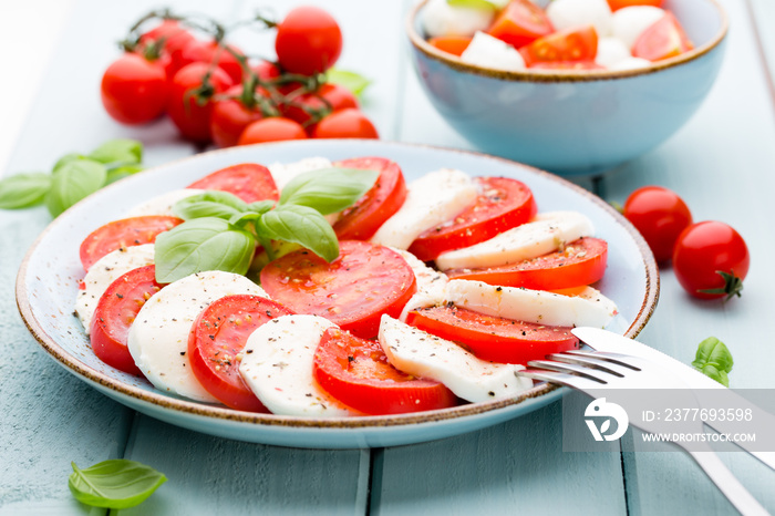 Classic caprese salad. Mozzarella tomatoes and  Basilikum.