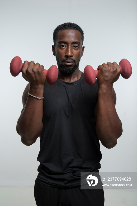 Man training arms with dumbbells