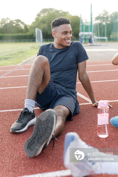 Athlete resting at sports track after training