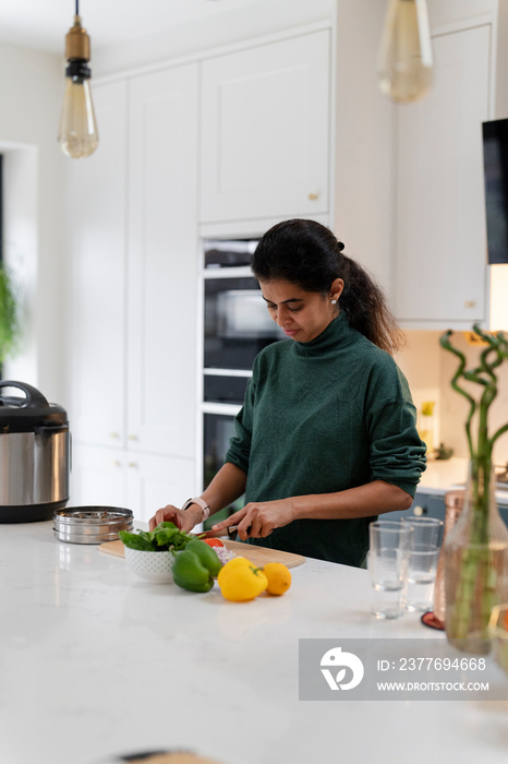 Woman preparing food in kitchen