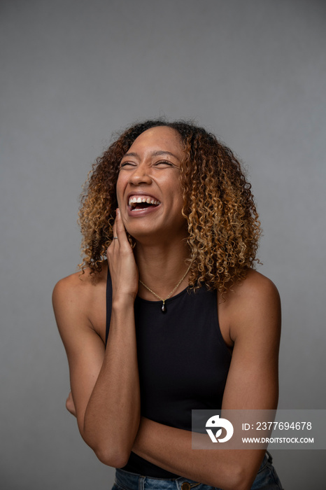 Portrait of laughing woman with curly hair